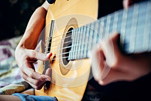 Musician playing acoustic guitar