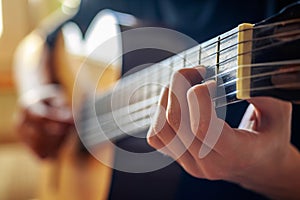 Musician playing acoustic guitar