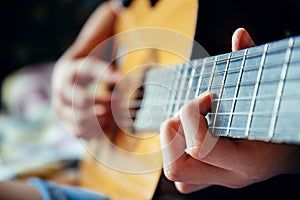 Musician playing acoustic guitar