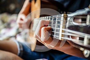 Musician playing acoustic guitar