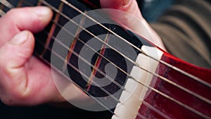 Musician playing acoustic guitar close up shot