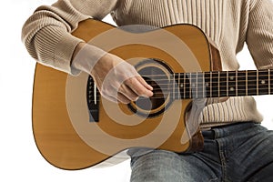 Musician playing an acoustic guitar