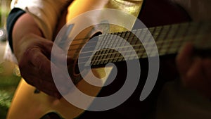 Musician playing acoustic guitar medium shot