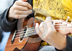 Musician playing acoustic guitar at a private party