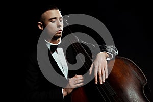 Musician playing on double bass isolated