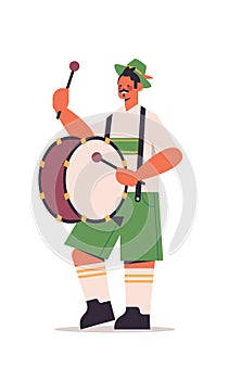 Musician playing drum on biggest folk festival Oktoberfest party concept