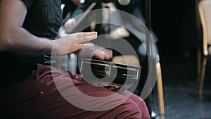 A musician playing a drum in a symphony orchestra