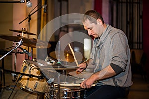 Musician playing drums on stage