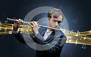 Musician playing on flute with notes around