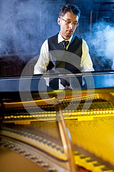 Musician playing the grand piano