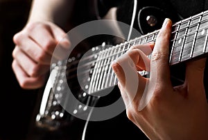 Musician playing guitar photo