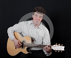 Musician playing a guitar