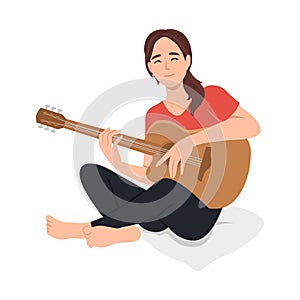 Musician playing guitar. Happy young woman guitarist with musical acoustic instrument. Modern creative relaxed music player.