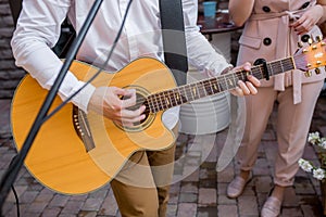 Musician playing guitar on wedding party