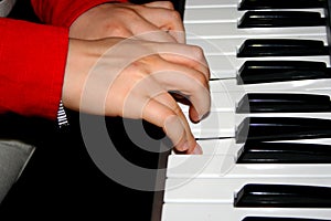 Musician playing on keyboards.