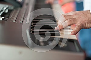 Musician playing on keyboards