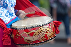 Musician playing with a Lion Drum