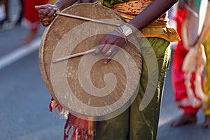 Musician playing with a malbar drum