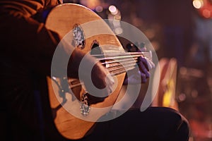 A Musician Playing Note on Oud Instrument