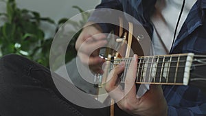 Musician playing rock ballad song on electric guitar practicing for live concept at home