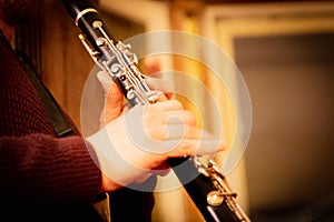 Musician is playing a saxophone at house concert