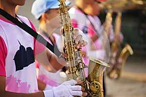 Musician playing the saxophone in the Marching Band Beautiful voice / Jazz mood Concept