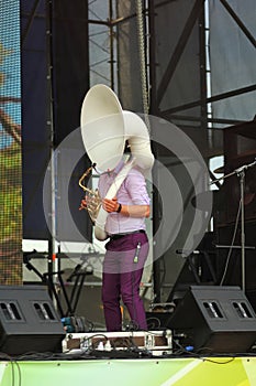 Musician playing sousaphone on stage photo