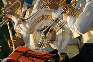 Musician are playing on trombones