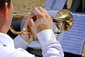 Musician playing on trumpet
