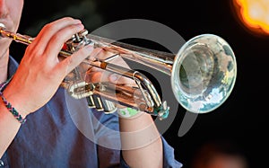 Musician playing trumpet at live concert