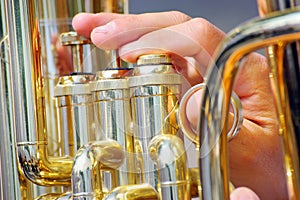 Musician playing tuba in street orchestra