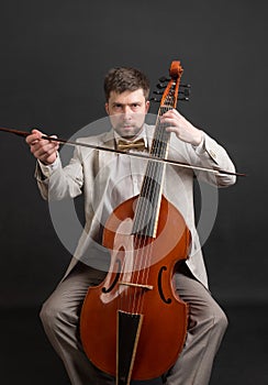 Musician playing the viola da gamba photo