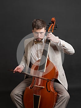 Musician playing the viola da gamba photo