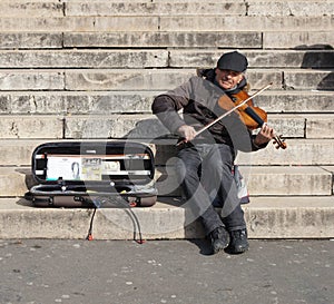 Musician Playing a Violin For Money