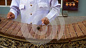 Musician playing the wooden thai gamelan