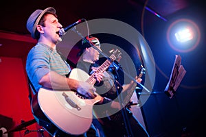 Musician plays a guitar