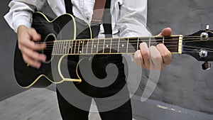 The musician plays the guitar.close-up