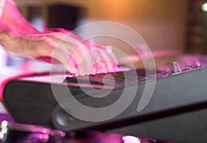 Musician plays keyboards in a rock band