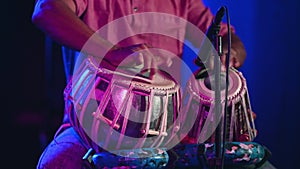 Musician seen playing tabla during event