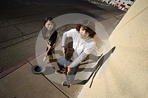 Musician on Sidewalk and Woman