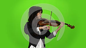 Musician standing and playing the violin. Green screen