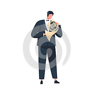 Musician in suit and bow performing classic melody on French horn. Instrumentalist playing music on brass instrument photo