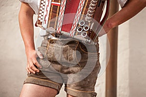 Musician in typical costume during an autumn local celebration in Val Isarco South Tirol