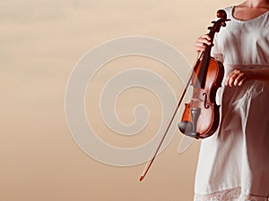 Musician violinist woman holding her violin