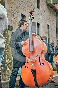 Musician violonchelo in the street in france