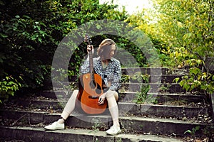 Musician woman and her guitar in good day