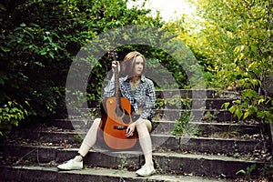 Musician woman and her guitar in good day