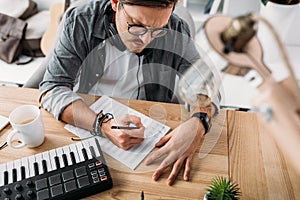 Musician writing notes photo