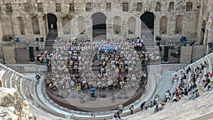 Musicians at the odeon of herodes atticus in athens, greece