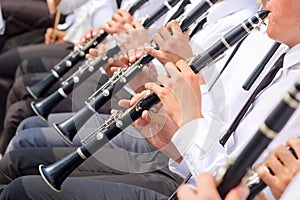 Musicians playing clarinet in street orchestra